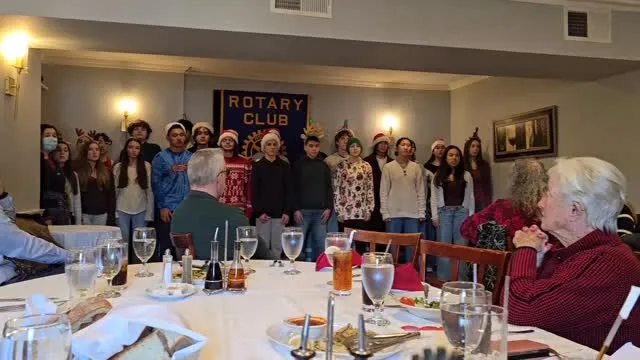 Pleasantville High School singers performing at the holiday luncheon