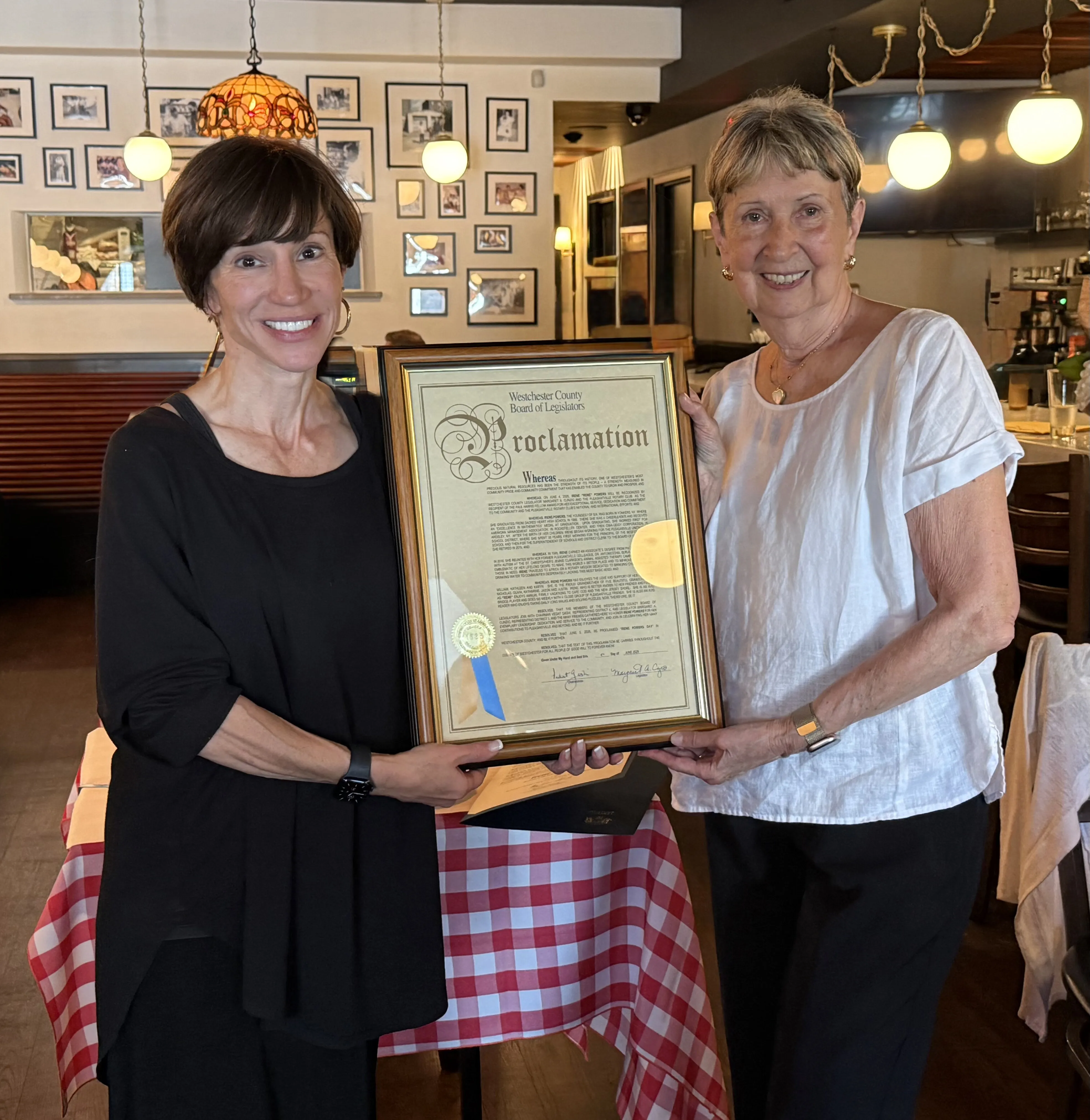 Margaret Cunzio presenting Irene Powers with a Westchester County Board of Legislators proclamation