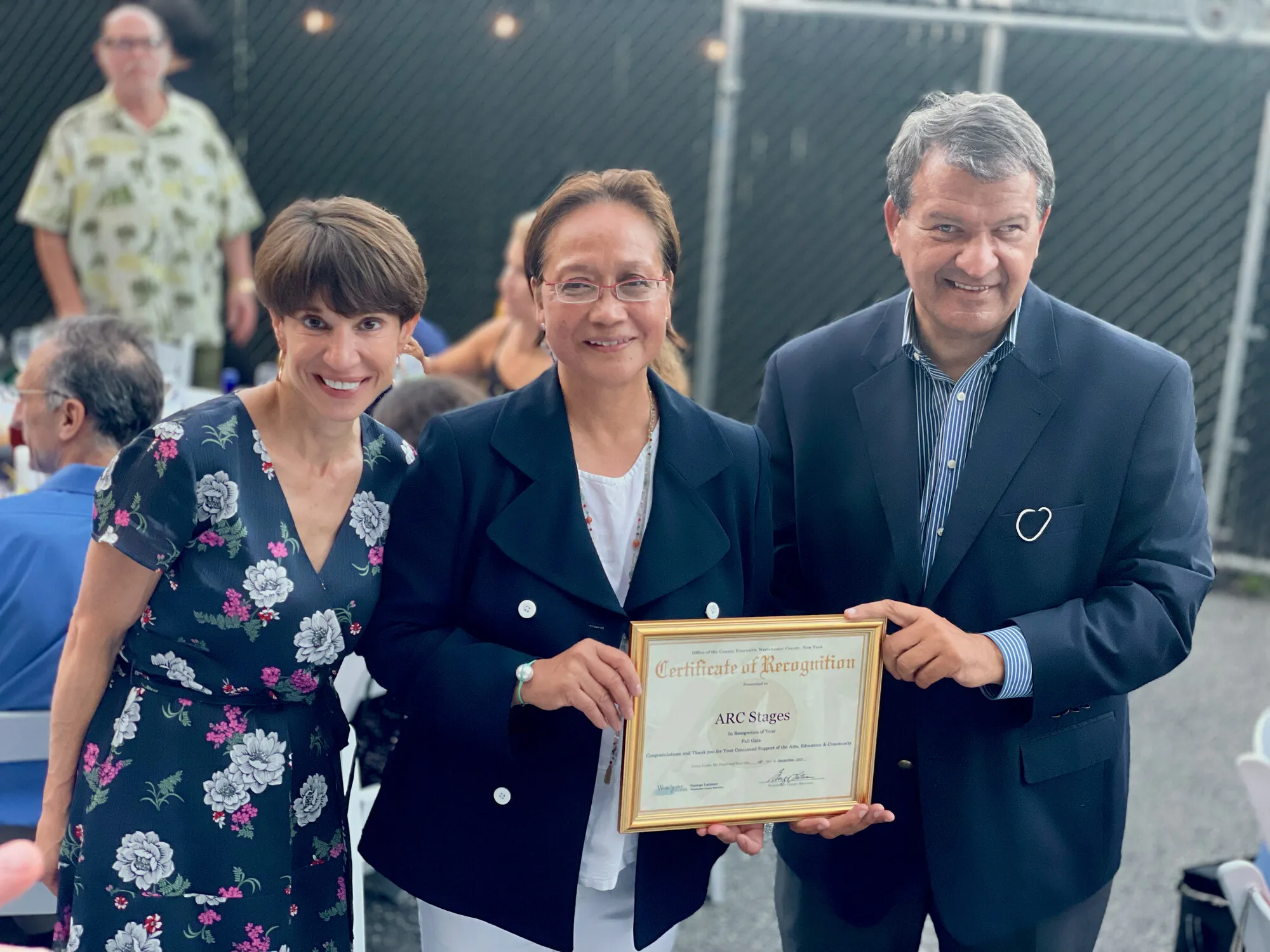 Marlene Canapi with Margaret Cunzio and County Executive George Latimer holding a certificate of recognition for Arc Stages