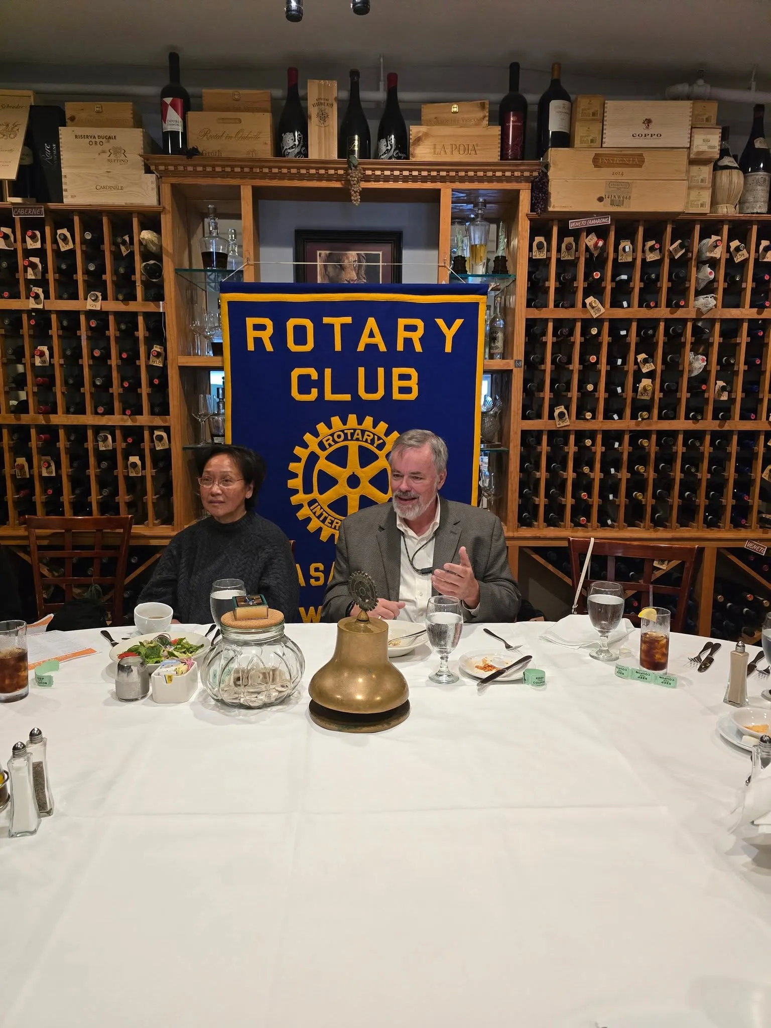 Marlene Canapi with Mayor Peter Scherer and Dr. Donald Antonecchia at the club banner