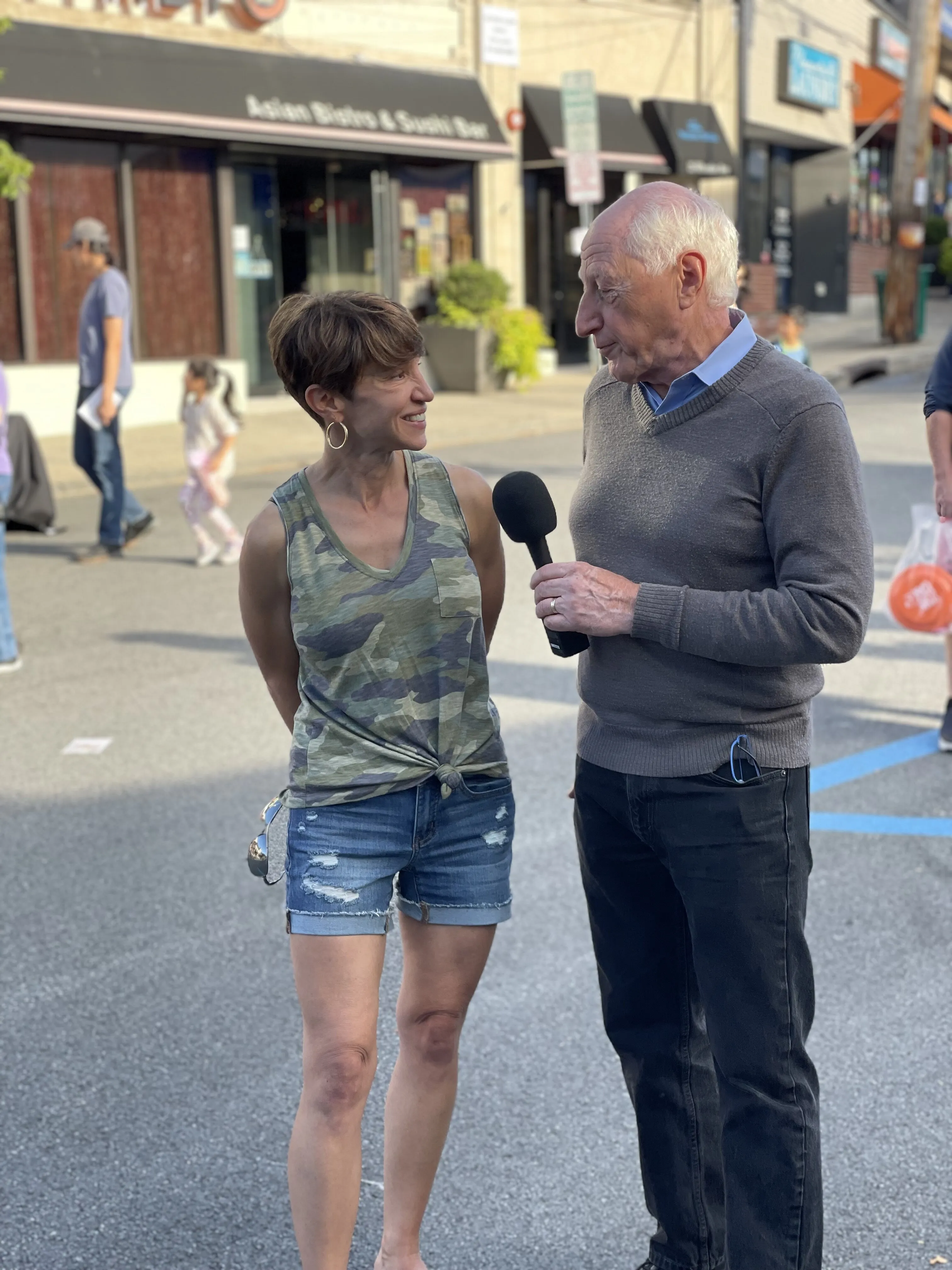A chat on Wheeler Avenue during the Pleasantville street fair